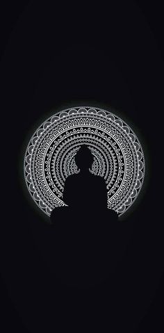 the silhouette of a person standing in front of a black background with an intricate design