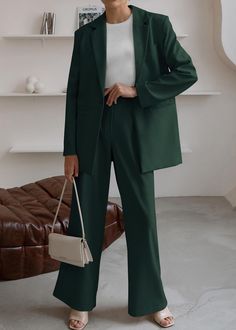 This Sophisticated Working Woman Blazer & Pants Suit Set is crafted from premium fabrics and attention to detail. The slim-fit blazer and tailored trousers are designed for both comfort and style, making it perfect for the working woman. The custom-made lining and secret pocket make it a practical choice for business meetings. Look professional and stylish with this must-have suit set. 95% Polyester, 5% Elastane Care instructions Machine Wash Size Chart XS = Dress 0-2, Bust, 31"-32.5", Waist 23" Latest Trendy Suits Women, Matching Blazer And Pants, Women’s Pantsuit Outfit, Women’s Pant Suit Outfit Formal, Suits For Women Wedding Guest, Green Business Outfit, Business Suits For Women Boss Lady, Women Suits Wedding Guest, Bridesmaid Suits For Women