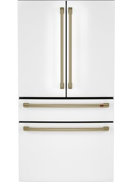 a white refrigerator freezer with two gold handles