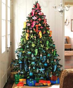 a decorated christmas tree with presents under it