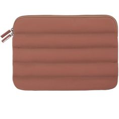 a brown leather pouch with zippers on the inside and side, sitting in front of a