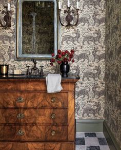 a bathroom with a wooden dresser and mirror