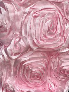 closeup of pink satin flowers on black background