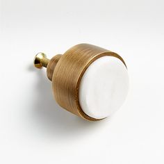 a close up of a knob on a white surface