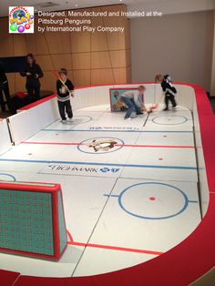 an ice hockey rink with people playing on it