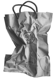 a black and white photo of a paper bag with the logo hives on it