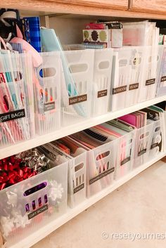 plastic storage bins are stacked on top of each other in this craft organization unit