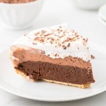 a piece of chocolate pie on a white plate