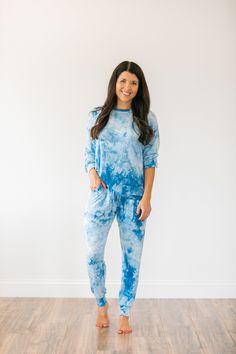 "Tie Dye Jogger Set/Tie Dye Lounge Set MATERIAL: A very soft and stretchy material. This is a lightweight material. 95% Cotton 5% Spandex (Black/White,Blue,Teal) 95% Polyester 5% Spandex (Pink) SIZING: Women's sizes Small, Medium, Large, X-Large **If you want a difference sized top/bottom within your set - I can certainly do that! Just make a note in the \"note to seller\" at checkout** Model is 5'4\", USA size 2, and wearing a size small. Overall Length: Small - 36.5 inches Medium - 37 inches L Comfy Cotton Sweats For Loungewear, Comfy Blue Sleepwear For Lounging, Relaxed Sweats For Lounging, Comfortable Cotton Sweats For Loungewear, Comfy Cozy Fit Sweats For Loungewear, Cozy Long Sweatpants For Loungewear, Comfortable Relaxed Fit Sweats For Loungewear, Relaxed Cotton Sweats For Loungewear, Cozy Sweats With Relaxed Fit For Lounging