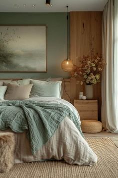 a bedroom with green walls and white bedding in the corner, along with a large painting on the wall