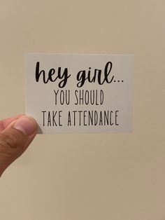 someone holding up a sticker with the words hey girl you should take attendance on it