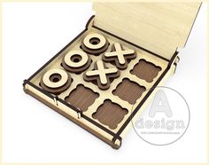 an open wooden box with chocolates in the shape of numbers and symbols on it