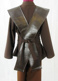 a woman's brown leather jacket on display