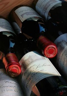 several bottles of wine are sitting in a wooden box