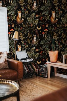 a living room filled with furniture and wallpaper