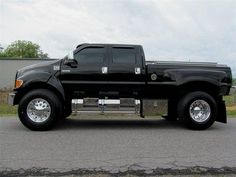 a black pickup truck parked in a parking lot