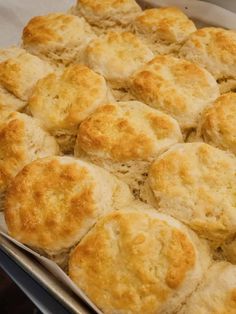 a pan filled with biscuits sitting on top of a table