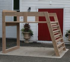 a wooden ladder sitting next to a white house