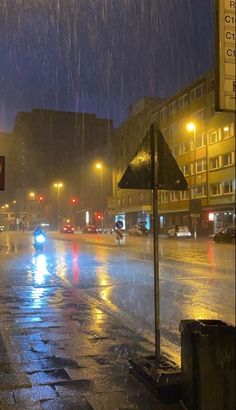 a city street at night in the rain