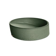 a green bowl sitting on top of a white surface