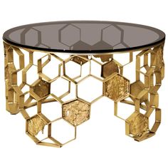 a glass and gold coffee table with hexagonal shapes