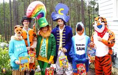 group of people dressed in costumes posing for the camera