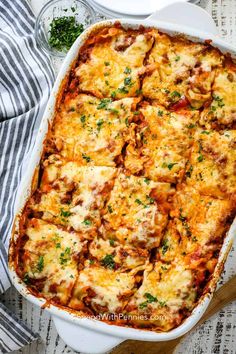 a casserole dish filled with meat and cheese