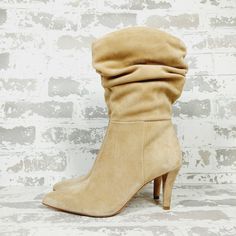 New Your Ensemble Gets The Too-Cool Status As Your Wear The Sonbela Boot From Vince Camuto. Eye-Catching Slouchy Shaft And A Just-Right Heel Highlight This Soft Suede Bootie Whereas The Side Zipper Closure Makes It Easy To Put On And Take Off. Suede Upper Inside Zipper Closure Pointed Toe Fabric Lining Approx. 12" Shaft Height Approx. 15.6" Calf Circumference 3.3" Covered Heel Synthetic Sole Vince Camuto Tan Boots, Tan Boots, Vince Camuto Shoes, Suede Booties, Soft Suede, Shoes Heels Boots, Vince Camuto, Put On, Bootie