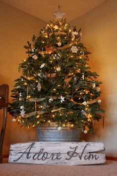 a small christmas tree sitting on top of a wooden crate