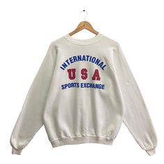 "Code : p/361 Vintage 90s Internasional Usa Sports Exchange White Sweatshirt Size Xlarge Usa Sports Crewneck Usa Sports Sweater Pullover Print Logi Jumper Size on Tag :  XL Details Measurement  Arm Pit to Arm Pit : 25\"inches Back Collar to Hem : 26\"inches Condition :  Great Vintage Condition(Used Clothing).No Holes And No Stain.Please refer pictures detail.‼️" Sports Crewneck, Sports Sweater, College Sweater, Sport Sweater, Sweater Pullover, White Sweatshirt, Used Clothing, Sweat Shirt, Vintage 90s