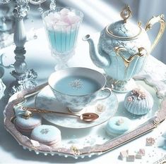 there is a tea set on the table with cup, saucer and other items