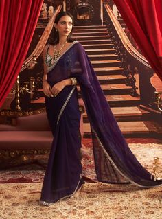 Step into elegance with this purple embellished blouse, complemented by a flowing organza sari and petticoat. The delicate embellishments enhance the blouse, while the lightweight organza drapes beautifully, creating a stunning look that's perfect for any festive celebration. Purple Organza Saree, Organza Sari, Saree For Wedding, Vacuum Storage, Indian Wedding Wear, Embellished Blouse, Sleeves Blouse, Desi Girl, Organza Saree