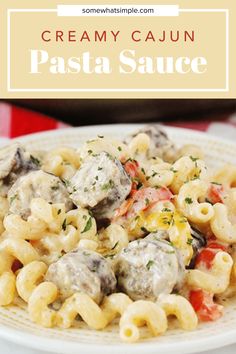 creamy cajun pasta sauce on a white plate with text overlay that reads creamy cajun pasta sauce