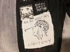 the back of a jacket with patches on it that say, ask me about my lobotomy