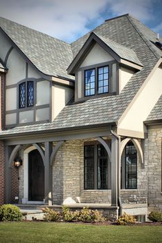 a large brick house with two story windows