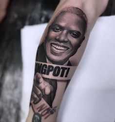 a man with a tattoo on his arm that says, wigpnott and is pointing to the side