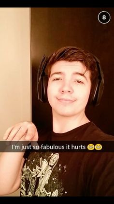 a young man wearing headphones in front of a mirror with the caption i'm just so fabulous it hurts