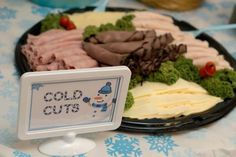 an assortment of cold cuts on a plate