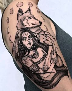 a woman with a wolf tattoo on her arm