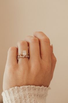 a woman's hand with a ring on it