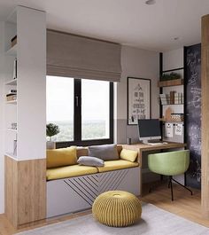 a living room filled with furniture and a chalkboard wall