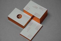 three business cards stacked on top of each other with the letter p in gold foil