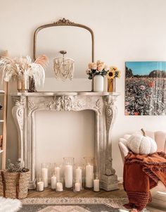 a living room filled with furniture and a fire place covered in candles next to a fireplace