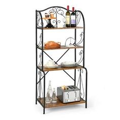 an iron and wood baker's rack with wine bottles, breads, glasses and other items