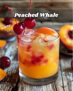 a drink with cherries on the top and peaches in the background that says peached whale