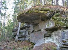 a rock formation with moss growing on it