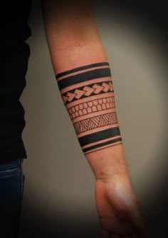 a man's arm with a tattoo on it and an arrow in the middle