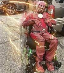 a man sitting in a wheel chair with lightning coming out of his face and head