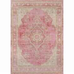 an antique rug with pink and gold colors