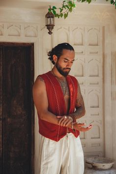 Organic handwoven cotton vest for men. Hand embroidered with a lot care to details and love AVAILABILITY This bohemian waist top is available in another colours: BEIGE https://www.etsy.com/listing/1162294731 DARK GREEN https://www.etsy.com/listing/1154343575 BLACK https://www.etsy.com/listing/1259015601 SANDAL WOOD https://www.etsy.com/listing/1158278970 OFF-WHITE https://www.etsy.com/listing/1160188734 ♡ FABRIC DETAILS ♡ Handwoven organic cotton fabric botanically dyed The garment is the treasu Groom Vest And Tie Boho, Boho Wedding Mens Vest, Mens Bohemian Vest, Moroccan Mens Fashion, Men's Boho Fashion, Romani Outfit Men, Men’s Vest, Bohemian Outfits For Men